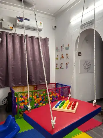 Occupational therapist assisting child with ADL training