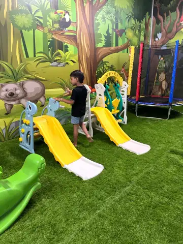 Child on balance board during physiotherapy at Star Tots